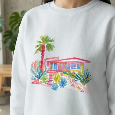 Watercolor illustration of a pink mid-century modern house with lush landscaping.