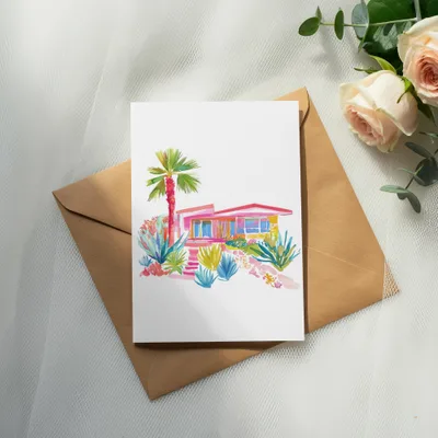 Watercolor illustration of a pink mid-century modern house with lush landscaping.