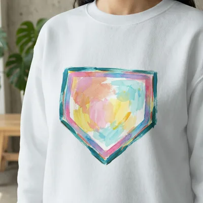 White sweatshirt with a colorful, abstract watercolor home plate design.