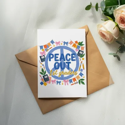 Card saying "Peace Out 1st Graders" with school-themed illustrations.
