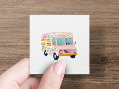 Pink food truck with floral decorations and shelves of food.