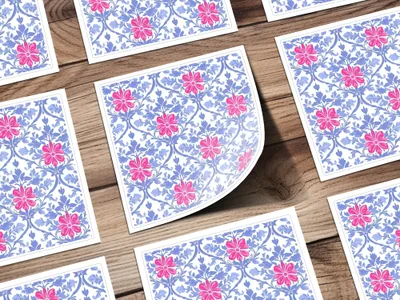 Floral pattern with pink flowers and blue leaves on white cards.