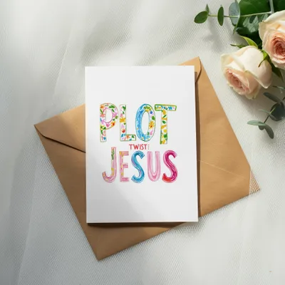 Greeting card with colorful "PLOT TWIST: JESUS" text on brown envelope.