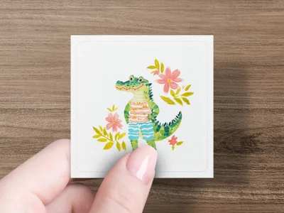 Illustration of a smiling alligator wearing striped shorts surrounded by flowers.