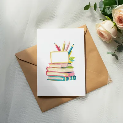Card with stack of colorful books, pencils, and blank golden frame.