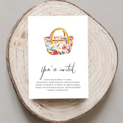 Floral picnic basket invitation with "You're invited" text.