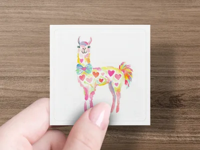 Watercolor llama with colorful hearts and a bowtie, held by a hand.