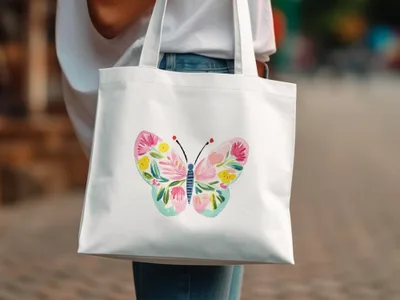 White tote bag with a colorful watercolor butterfly design.