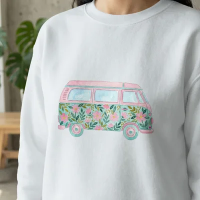 White sweatshirt with a watercolor illustration of a floral camper van.