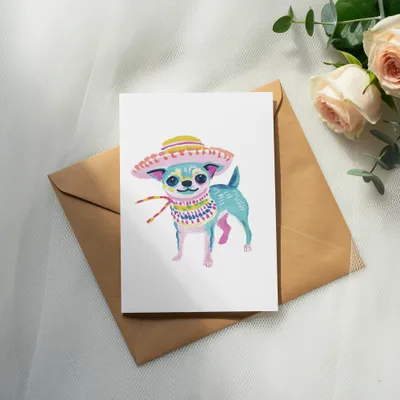 Watercolor chihuahua in a sombrero and colorful scarf on a card.
