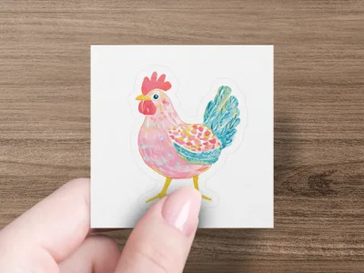 Pink and blue watercolor rooster sticker held by a hand with painted nails.