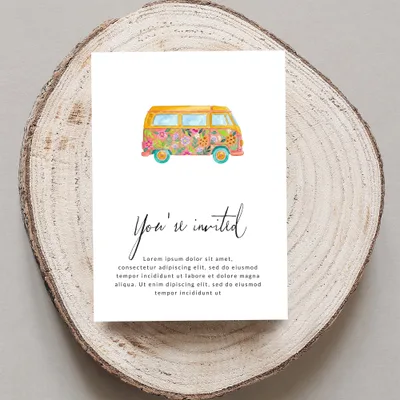Invitation card with floral camper van and placeholder text.