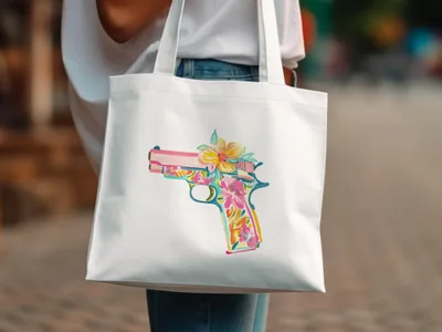 White tote bag with a colorful floral handgun graphic.
