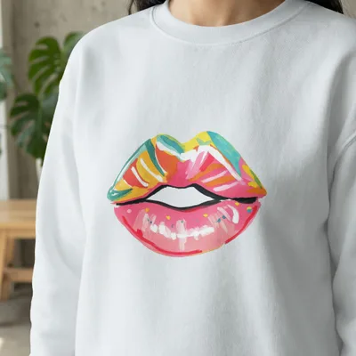 White sweatshirt with a colorful painted lips design.