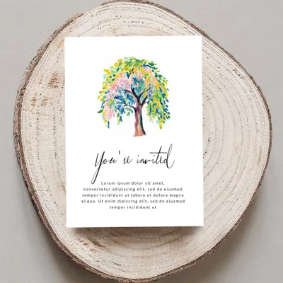 Invitation with colorful tree and "You're invited" text.