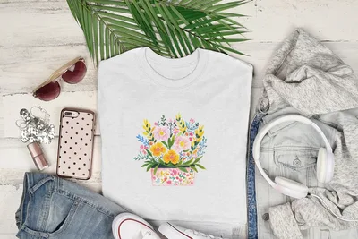 White t-shirt with colorful floral illustration in a pink pot.