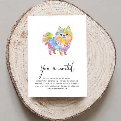 Colorful Pomeranian dog on invitation card with "You're invited" text.