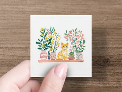 Orange tabby cat sits between two potted plants on a shelf.