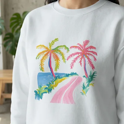 White sweatshirt with watercolor painting of two palm trees and a road.