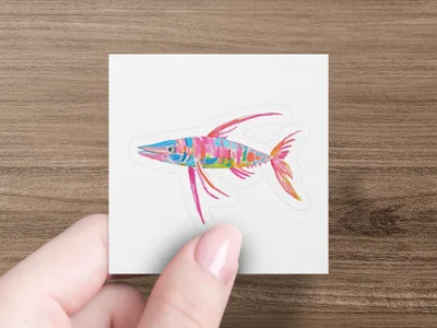 Colorful watercolor illustration of a fish on a white card held by a hand.