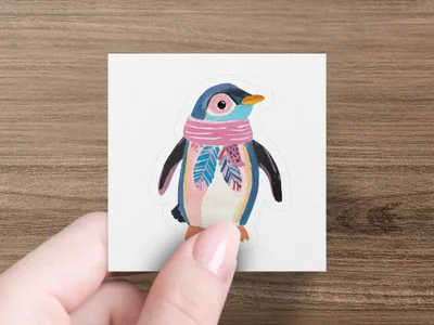 Cartoon penguin wearing a pink and blue striped scarf.