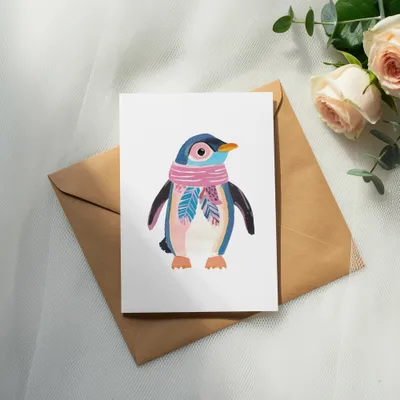 Watercolor penguin wearing a pink scarf on a card with an envelope.