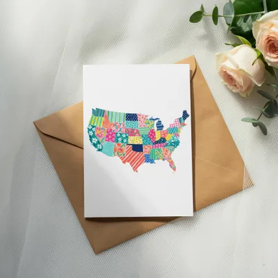 Card featuring a U.S. map made of colorful patchwork fabric squares.