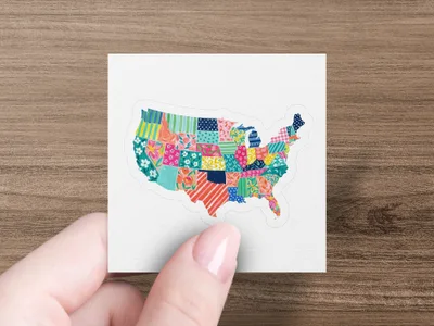 Map of the United States made of colorful, patterned fabric squares.