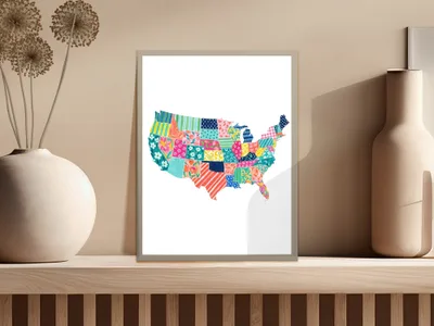 Colorful patchwork map of the United States of America displayed in a frame.