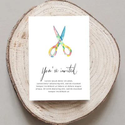 Invitation with scissors graphic and "You're invited" text.