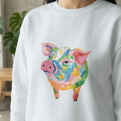 White sweatshirt with a colorful, painterly illustration of a pig.