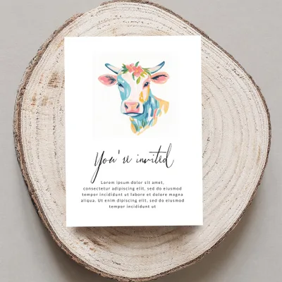 Invitation with watercolor cow and "You're invited" text.