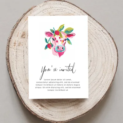Cow with floral wreath invitation, "You're invited" text.