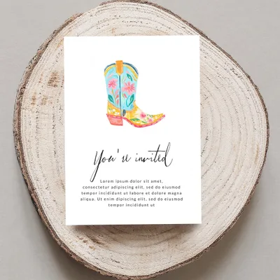 Watercolor cowboy boot on invitation with "You're invited" text.