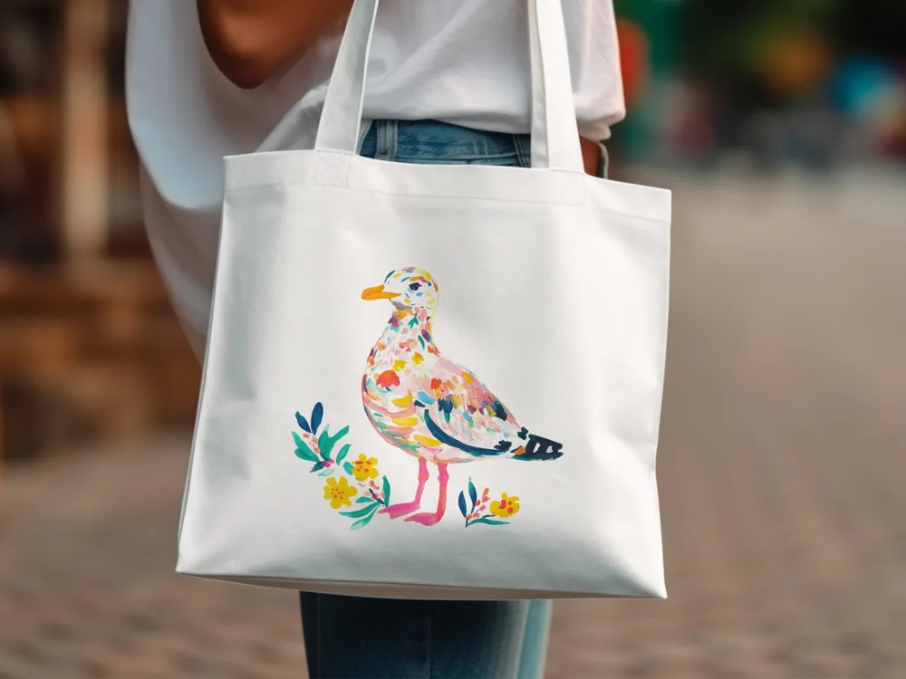 White tote bag with colorful abstract bird and floral design.