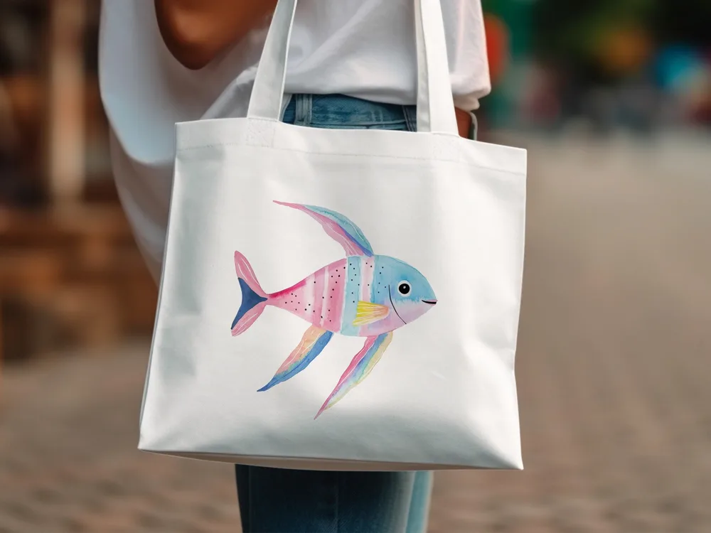 White tote bag with a watercolor painting of a colorful, tropical fish.
