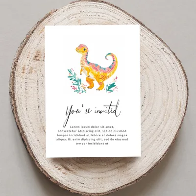 Invitation card with cartoon dinosaur and floral accents, featuring "You're invited" text.