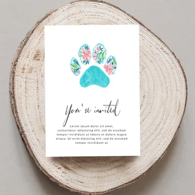 Invitation with floral paw print and "You're invited" text.