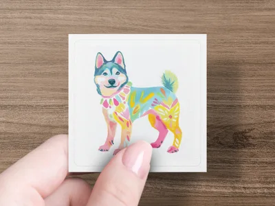 Husky dog illustration with colorful floral patterns on a white card held by a hand.