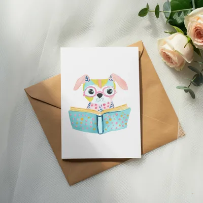 Cartoon dog wearing glasses reads an open book with colorful dots.
