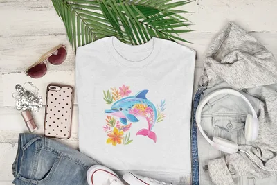 White t-shirt with a colorful dolphin and floral design.