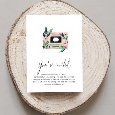 Invitation card with floral cassette tape design and placeholder text.