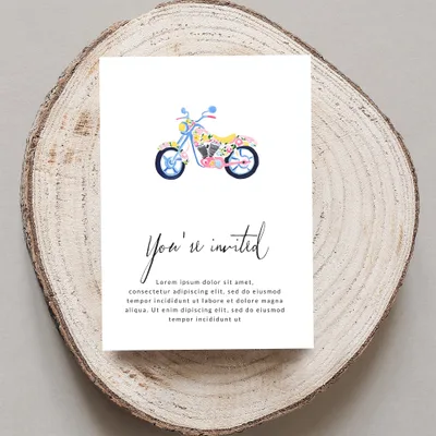 Invitation card with floral motorcycle and "You're invited" text.
