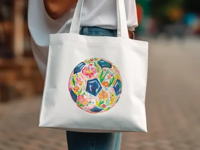 White tote bag with a floral soccer ball design.