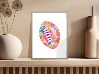 Colorful floral pattern on a rugby ball in a framed print.