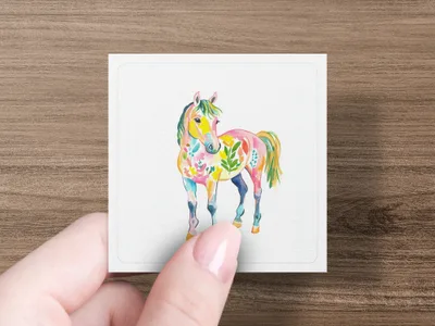 Watercolor illustration of a colorful horse with floral patterns.