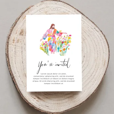 Invitation with watercolor Jesus among flowers and "You're invited" text.