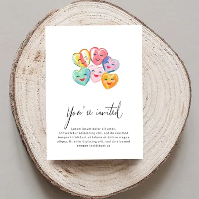 Invitation card with smiling candy hearts and placeholder text.