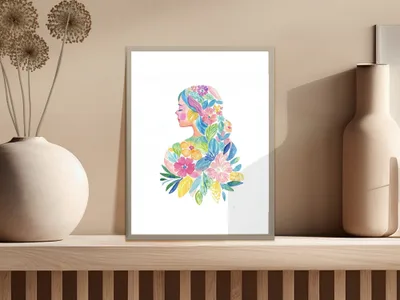 Watercolor illustration of a woman's profile with floral hair.