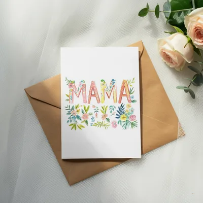 Greeting card with "MAMA" in floral lettering on a brown envelope.